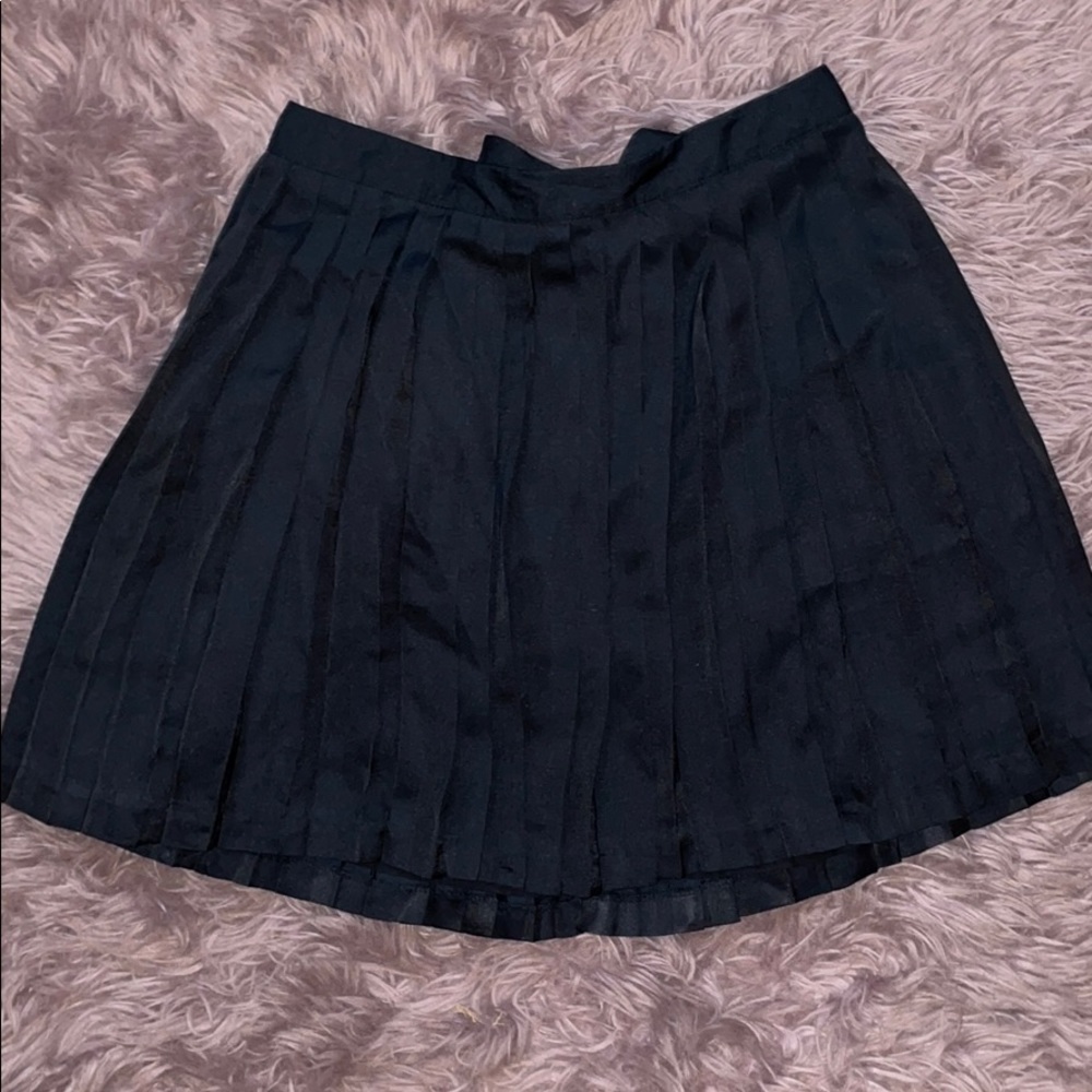 Dark navy skirt with pleats.